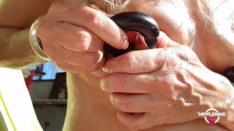 Nippleringlover Horny Milf Inserting 18mm Nipple Rings In Extreme Stretched Nipple Piercings Outside_main_thumbnail